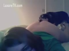 Cute little pooch licks his master's pussy